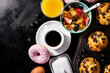 Tasty fresh breakfast food ingredients on black dark background. Ready to cook. Home Healthy Food Cooking Concept. Copy Space. Toning.