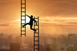 © Elnur - Businessman climbing career ladder in business concept