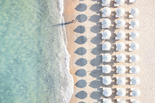 Aerial View Of White Beach, Umbrellas And Turquoise Clear Water During Sunset, Mediterranean Sea, Sardinia, Italy,