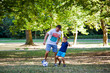 © Coka - father and his little son play soccer in park