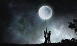 Fototapeta Na sufit - People catching moon