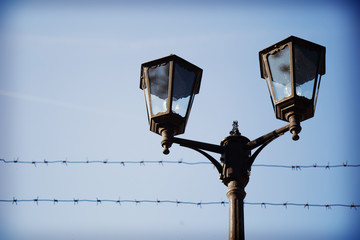 Street lights in metallic retro style on a blue sky  background