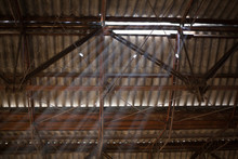 Light Beams Protruding From Old Factory Ceiling 
