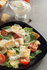 Canvas Print - caesar salad and ingredients at table