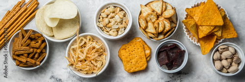 Fotografía Salty beer snacks in whit bowls