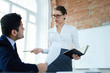 © pressmaster - Strict woman talking to her subordinate or colleague