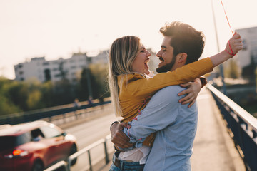 Wall Mural - young couple hugging dating and kissing outdoor