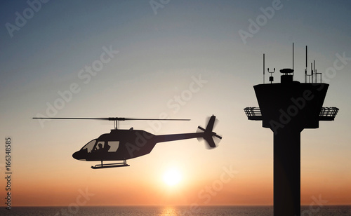 Plakat helikopter na zachód słońca