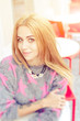 © luchschenF - Portrait of a cute blonde girl sitting in a street cafe