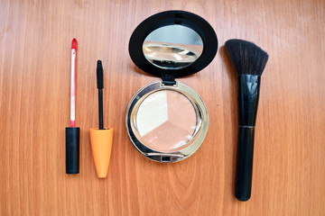 mascara, lipstick, powder, brush, mirror for face, lips, eyes, jowls, lashes make up