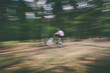 © Peter Meciar/Stocksy - Man riding mountain bike - high speed panning