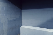 Painted Blue Cinderblock Wall With Shadow