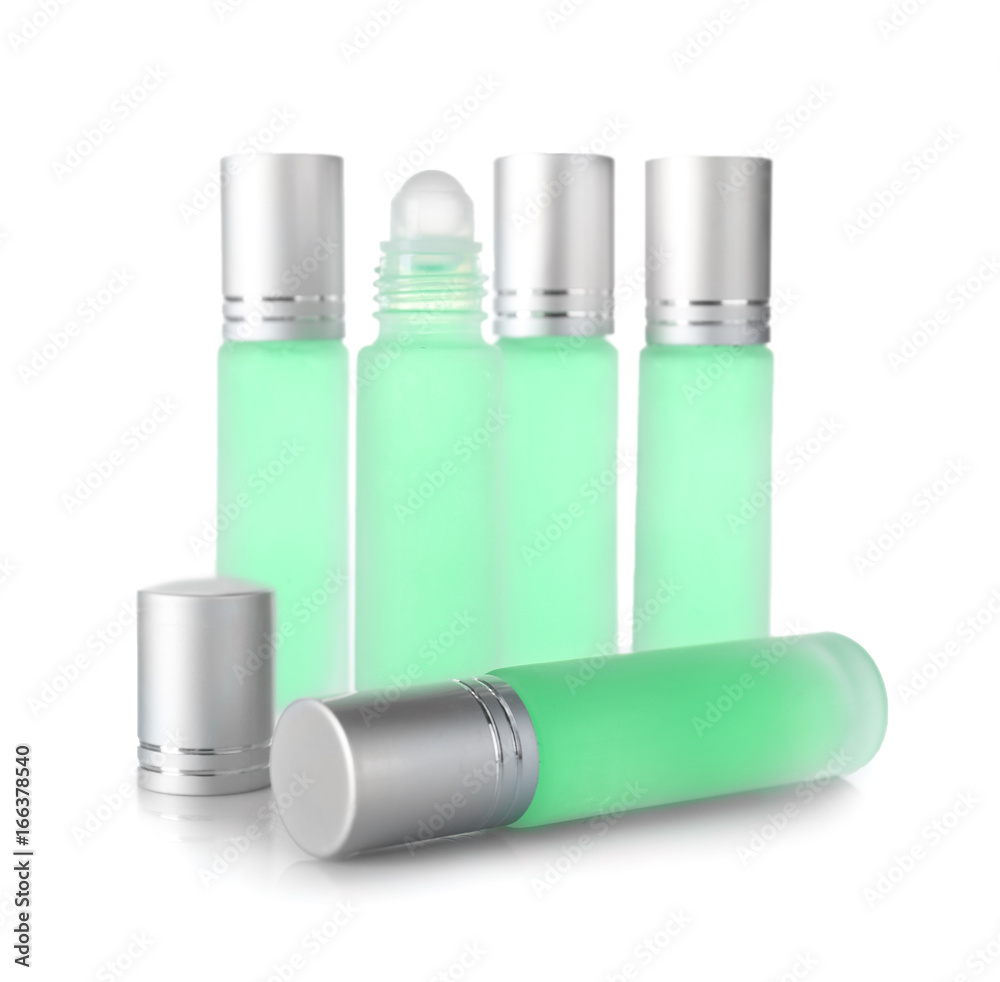 Bottles of modern perfume on white background