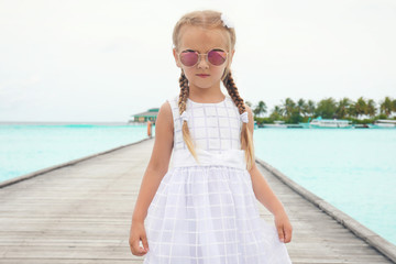 Canvas Print - Cute little girl at sea resort