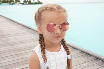 Canvas Print - Cute little girl at sea resort