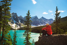 Hiker Enjoying The View Of Moraine Lake In Banff National Park, Canada