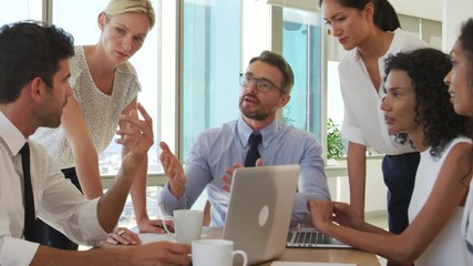 Poster - Group Of Businesspeople Meeting Around Table In Office