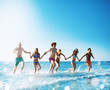 © alphaspirit - Group of friends run in the sea. Concept of summertime