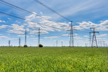 Wall Mural - high-voltage power lines at sunset. electricity distribution station. high voltage electric transmission tower