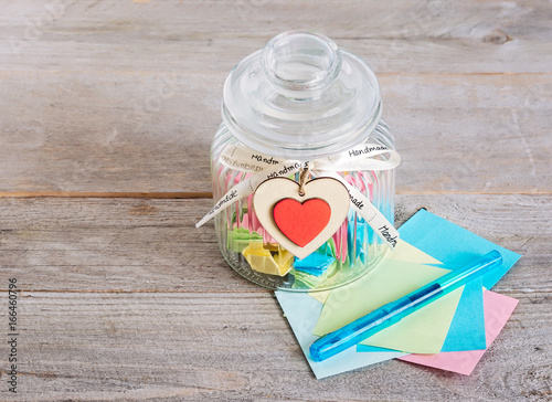 Glass Jar With Handmade Wooden Hearts Decorations And Ribbon Near