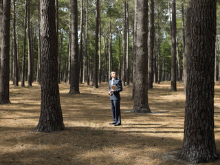 Businessman in forest