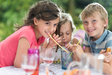 Poster - Three Children having a snack in the garden