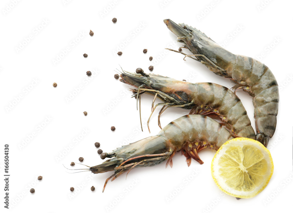 Fresh shrimps with lemon on white background
