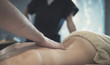 © NDABCREATIVITY - Masseur massaging back of female