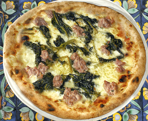Italy Naples Pizza With Sausage And A Particular Kind Of Turnip