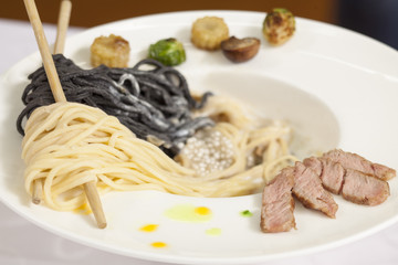 Wall Mural - Black and white pasta with beef and caviar