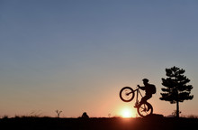 Lone Cyclist And Sunrise Peace