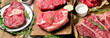 Raw beef meat on a dark wooden board.