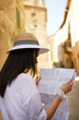 © ZoomTeam - travel guide, tourism in Europe, woman tourist with map