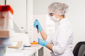 researcher with pipette.