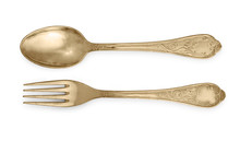 Golden Spoon And Fork Isolated On A White Background.