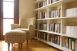 © Carla Nichiata - Home library with arm chair. Clean and modern decoration.