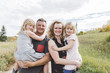 © Carey Shaw/Stocksy - Modern family standing together outdoors