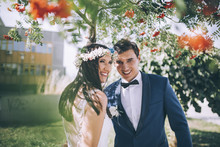 Bride And Groom Laughing Outdoors In Nature