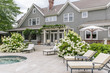 © Raymond Forbes LLC/Stocksy - Residential Pool Patio in Summer