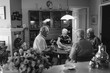 © Rob and Julia Campbell/Stocksy - Group of seniors playing games together inside