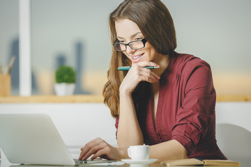 Poster - European businesswoman using laptop