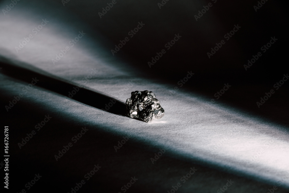 Pyrite, Commonly Known As Fool's Gold, Illuminated By Beam Of Light ...