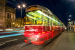 Illuminated Opera house in Vienna, Austria and tram
