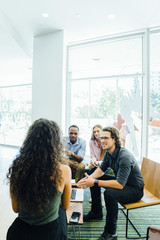 Wall Mural - Diverse group of coworkers meeting in modern office space