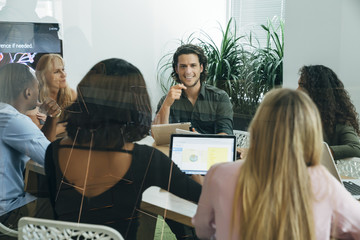 Wall Mural - Group of people having a business meeting in modern office space