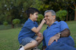 © IndiaPix - Grandson touching his grandfathers nose