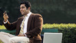 © IndiaPix - Businessman reading a message on a mobile phone