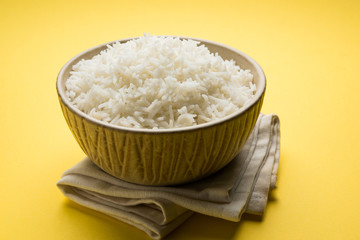 basmati rice in a ceramic bowl, indian white and long basmati rice cooked and served in bowl, selective focus