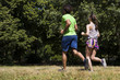 © BGStock72 - Young couple running in the park on a sunny day