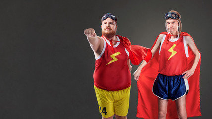 Two funny men dressed as superheroes